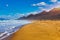 Amazing Cofete beach with endless horizon. Volcanic hills in the background and Atlantic Ocean. Cofete beach, Fuerteventura,