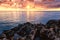 Amazing colorful sunrise over the sea and rocks, scenic seascape, Cavo Greko, Ayia Napa, Cyprus