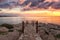 Amazing colorful sunrise over the sea, rocks and stone stairs, scenic seascape, Cavo Greko, Ayia Napa, Cyprus