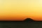 Amazing colorful sunset panorama with silhouette of volcano island Stromboli