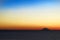 Amazing colorful sunset panorama with silhouette of volcano island Stromboli