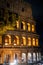 Amazing colosseum stadium exterior illuminated at night