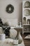 Amazing composition on white design shelf with christmas decoration, lights, gifts, lanterns ,deer, candles, stars, white corduroy