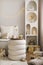 Amazing composition on white design shelf with christmas decoration, lights, gifts, lanterns ,deer, candles, stars, white corduroy