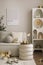 Amazing composition on white design shelf with mock up poster frame, christmas decoration, lights, gifts, lanterns ,deer, candles