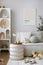 Amazing composition on white design shelf with mock up poster frame, christmas decoration, lights, gifts, lanterns ,deer, candles