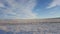 Amazing deep blue sky with cirrus feather-shaped clouds over dry grassland - nature background. Cirrus clouds over the