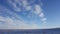 Amazing deep blue sky with cirrus feather-shaped clouds over dry grassland - nature background. Cirrus clouds over the