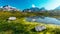 Amazing Dolomites Mountains. Landscape with calm mountains lake and bluel sky. Wonderful Nature Landscape in summer