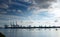 Amazing dramatic sky, clouds formation and industrial cargo district on dark background. Cargo port in Birzebugga, Malta.