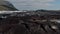 Amazing drone view of Breidamerkurjokull glacier tongue and volcanic mountains around. Birds eye of volcanic rock