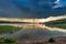 Amazing dusk at the summer lake with dynamic clouds