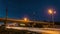 Amazing evening cityscape railways metal bridge and road with traffic sky with stars timelapse
