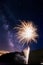 Amazing fireworks display on Lake Joseph, Ontario, with the milky way visible above.