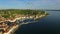 Amazing flight with birds over old city Piran in Slovenia, aerial panoramic view of old houses, roofs, fortress and the sea.