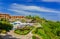 Amazing fragment of view of Sol Rio de Luna y Mares hotel and grounds with people relaxing in background