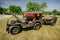 Amazing front and side view of classic vintage military vintage jeep with a small trailer