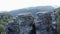 Amazing geological formations and green mountain valley on a summer day.