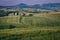 Amazing grain fields with Vitaleta chapel and Pienza, Tuscany, Italy