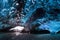Amazing ice cave. Blue crystal ice cave and an underground river beneath the glacier. Amazing nature of Skaftafell.