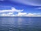 Amazing Idyllic ocean and Cloudy sky with endless horizon in vac