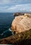 Amazing Irish stone cliffs in the blue sea with a blue sky