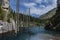 amazing Kaindy Lake in the Tien Shan mountains in Kazakhstan in summer. Mysterious lake with a sunken fir forest