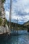 amazing Kaindy Lake in the Tien Shan mountains in summer in Kazakhstan on cloudy day. A mysterious lake with a sunken