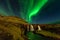 Amazing landscape with green bands of Aurora Borealis. Snaefellnes, Iceland
