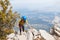 Amazing landscape with a mountain range and a tourist with a backpack in the foreground. mountaineering and climbing