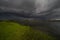 Amazing landscape of nature before thunderstorm. Dark clouds above wild river. Dramatic weather