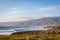 Amazing landscape scenario at the Guincho beach in Cascais, Portugal. Sunset colors, mountains, big waves.