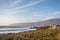 Amazing landscape scenario at the Guincho beach in Cascais, Portugal. Sunset colors, mountains, big waves.