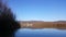 Amazing landscape seen from the kayak. forest reflecting in the lake water. extreme sports combined with relaxation during the aut