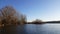 Amazing landscape seen from the kayak. forest reflecting in the lake water. extreme sports combined with relaxation during the aut