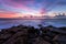 Amazing landscape at sunset. Stones on the foreground. Breathtaking sunrise seascape scenery over Black sea in Bulgaria. Epic dawn