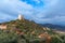 Amazing landscape of the Tuscan countryside with the medieval fortress Rocca of Tentennano on the hill in winter