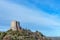 Amazing landscape of the Tuscan countryside with the medieval fortress Rocca of Tentennano on the hill in winter