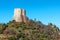 Amazing landscape of the Tuscan countryside with the medieval fortress Rocca of Tentennano on the hill in winter