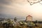 Amazing landscape view of Byblos, traditional house, rocks, palms trees, mountains in the background. Haze warm light in Lebanon