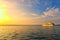 Amazing landscape view of huge large white cruise ship. Panoramic dramatic sunset sky. Ship glides out of the port of Koper.