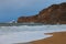 Amazing landscape view of stormy Atlantic ocean near famous touristic city Nazare. Big wave breaks about picturesque cliff