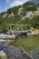 Amazing Landscape of Wooden bridge over River near Vihren hut, Pirin Mountain