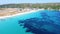 Amazing long sandy beach and turquoise transparent sea from the sky. Aerial view of summer resort and vacation concept