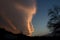 Amazing looks like face cloud and silhouette of the ground and a tree at sunset