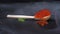 Amazing luxury presentation of portion of red salmon caviar lies in handmade wooden spoon, black background. Clouds of