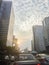 Amazing mammatus clouds over Bangkok, Thailand, with tall buildings foreground.