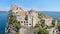 Amazing medieval castle on small island in blue Gulf of Naples, travel to Italy