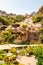 Amazing medieval Positano cityscape on rocky landscape, local businesses, hotels, shops, restaurants and private houses surrounded