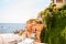 Amazing medieval Positano cityscape on Tyrrhenian sea full of boats and yachts background, local businesses and private houses